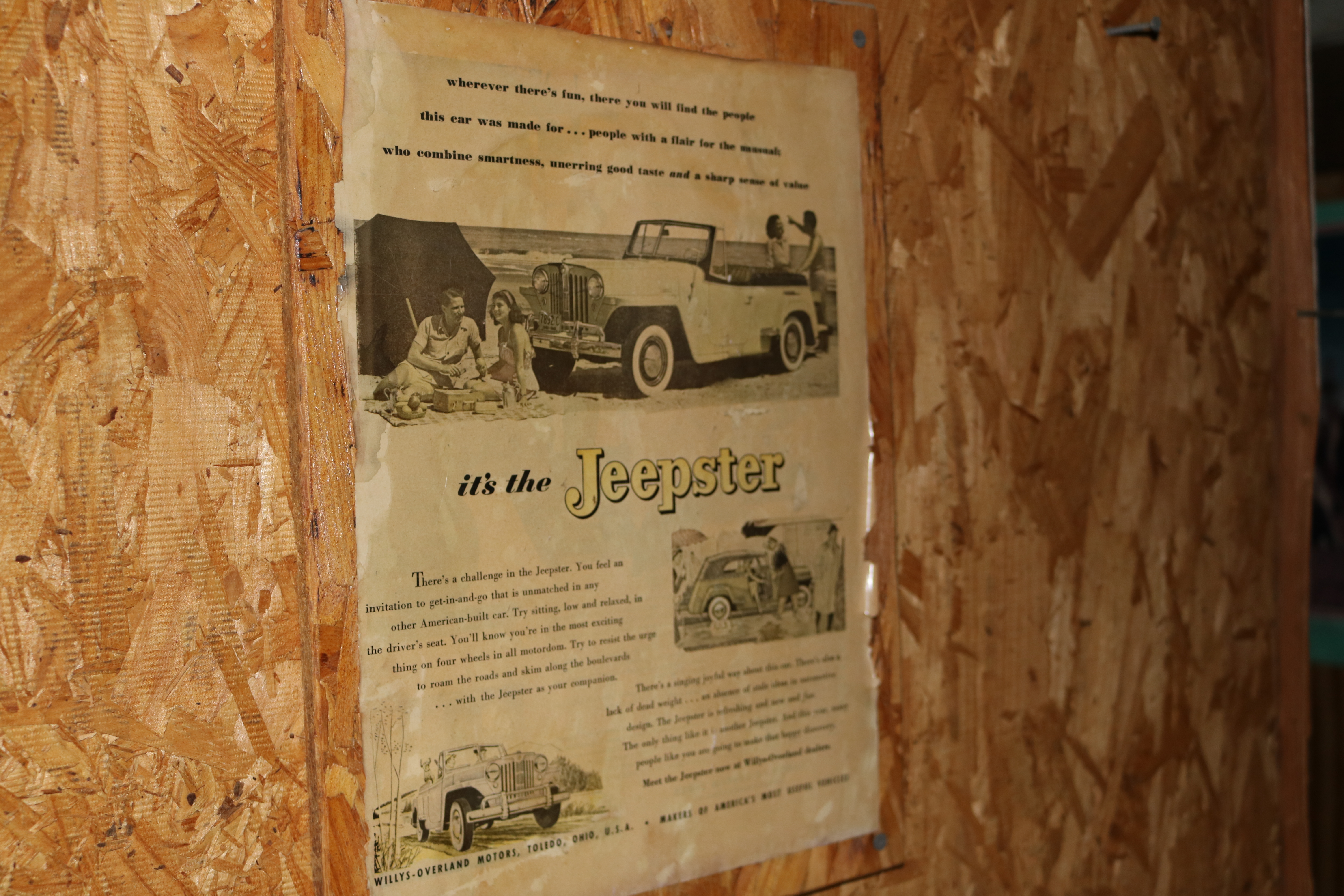 Flyers/photos/articles framed on a wall.